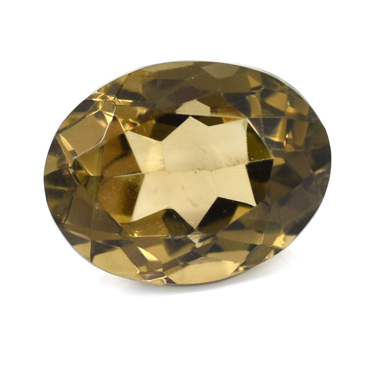 Oval-cut golden gemstone with facets reflecting light.