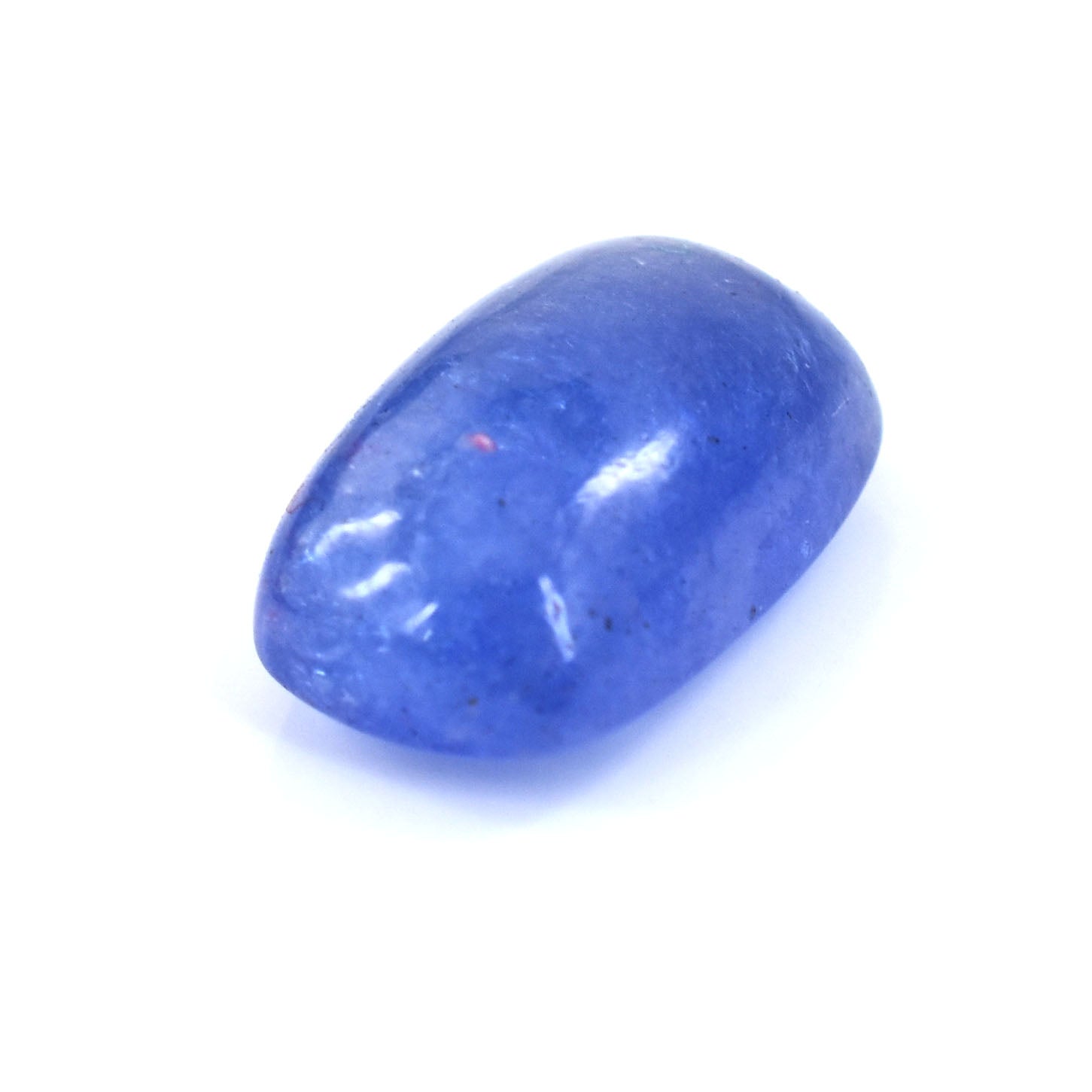 Oval-shaped blue gemstone with a smooth, polished surface.