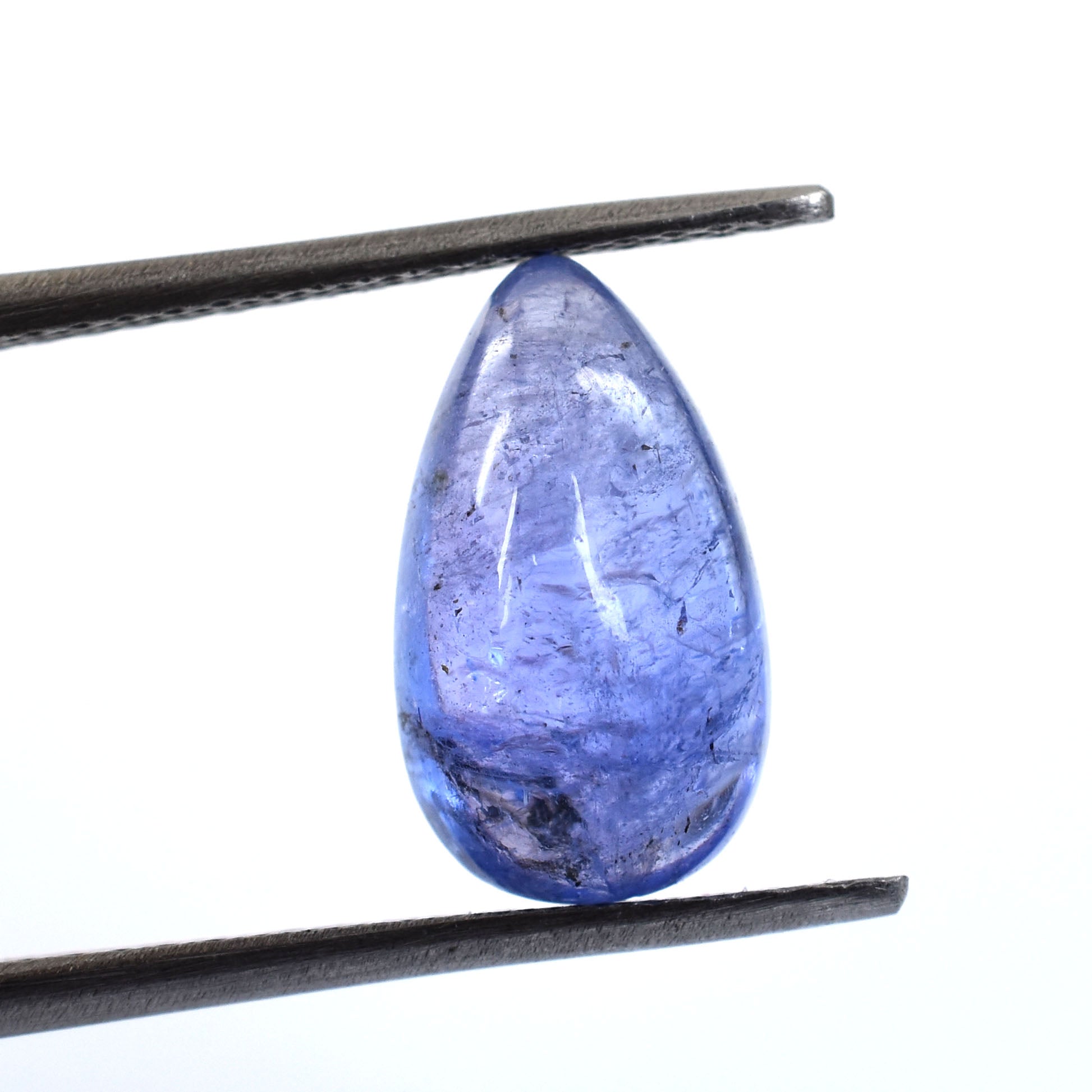 Teardrop-shaped blue gemstone held between tweezers.